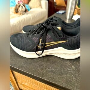 Women's Nike black and gold sneakers size 8 1/2 like new. Worn once